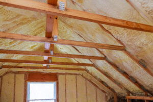 Insulated attic with wooden beams